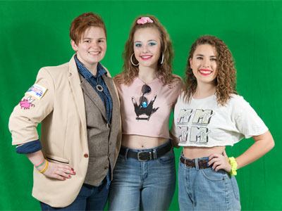 High school kids born in the 2000s dressed in 1980s styles.