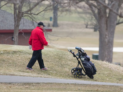 This guy has a golf bag on wheels that propels itself.