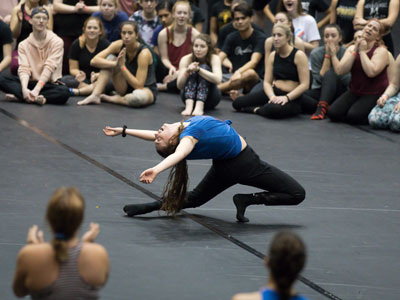 Look at the dancer, yes, but then look at the girls in the upper right.