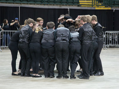 A pep talk before taking the floor.