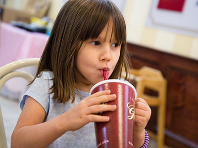 She ate her ice cream and then helped daddy finish his shake.