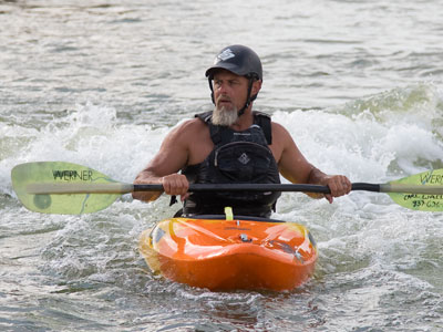 Kayakers and surfers peacefully coexist at RiverScape.