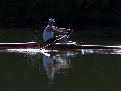 Driving in my car, planning to go someplace else, I saw him rowing.  I turned, parked, walked, and waited for him.