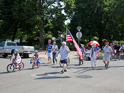 The neighborhood parade is a July 4th tradition in the Oregon District (but face masks are new this year).