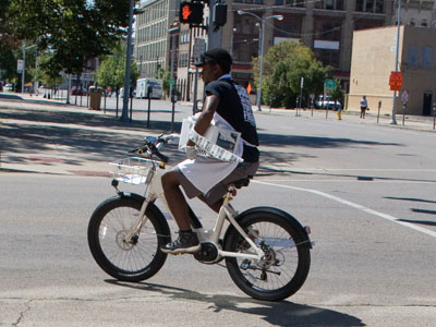 `Subs so fast you`ll freak,` says his shirt.  I freak when they ride their delivery bikes through red lights and the wrong way down the street.