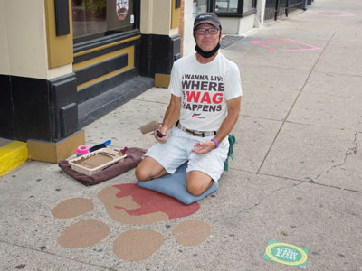 Repainting the giant paw prints (see August 2 above).