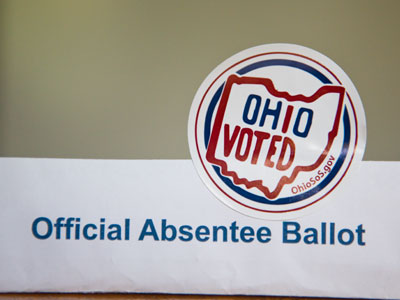 Ohio`s Secretary of State deliberately makes it harder for people to vote, but he gives stickers to those who do.  When he`s up for reelection, I`ll let him know how I feel.