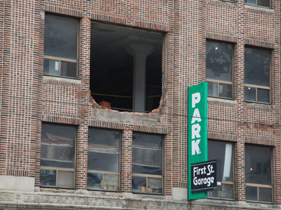 Somebody drove their car through the garage wall and onto the sidewalk below (see March 23 above).