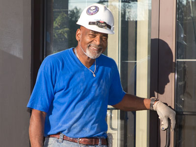 Claude the carpenter posed for a picture and then gave me his business card so he could get a copy of it.