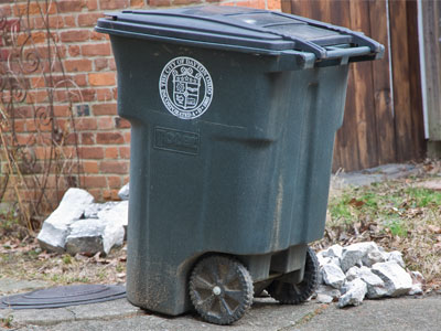 Life is full of challenges:  somebody put chunks of concrete in the trash cans.