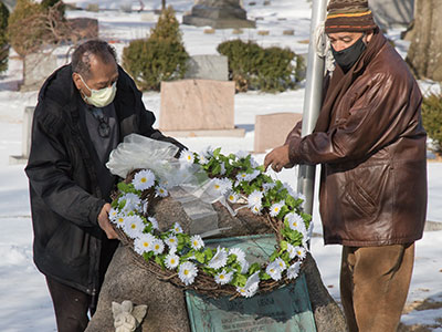 Frank Sci and Mitchell Cape placed a wreath on Dunbar`s grave.