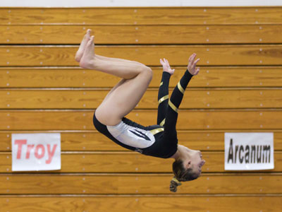 There was a gymnastics competition halfway between Troy and Arcanum.