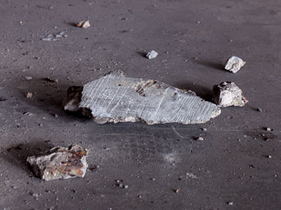 Cement falls from the ceiling in my parking garage.