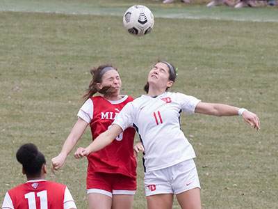 I wanted to shoot pictures from the field, but was politely told to sit in the spectator stands. It turned out okay.