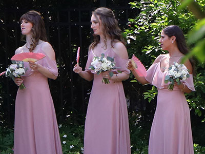 The bridesmaids stayed in the shade so they didn`t wilt.