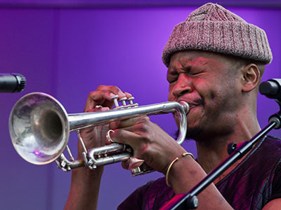 Most of the time he played trumpet with one hand while playing a keyboard with the other.