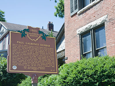 You should visit the Dunbar House to celebrate his 150th birthday.