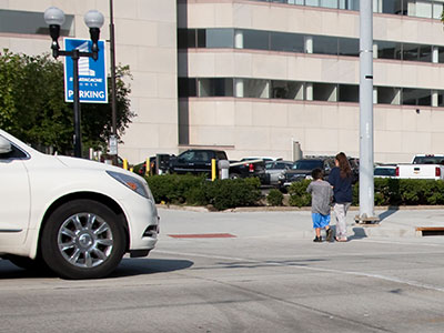 Mother of the Year Award to her for walking her kid into traffic against the light.