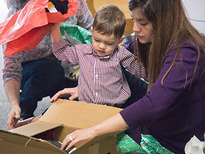 Digging through the clothes to get to the toys.