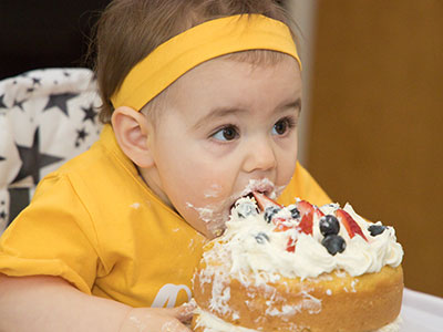 By eating this way, her hands don`t get as messy.