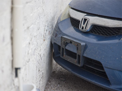 Car vs. wall.  Wall wins.