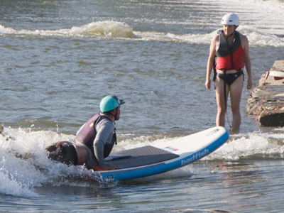 I respect educators in any setting.  He`s telling her -- and showing her -- how to river surf.