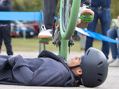 A skilled cyclist meets a fearless volunteer.