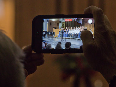 The choir director said, `Please don`t record videos.`