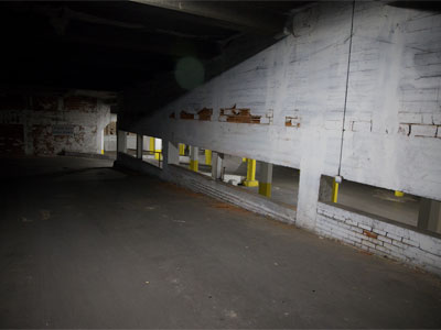 To avoid stepping over anybody sleeping in the stairwell, I walked down the ramp of the parking garage.