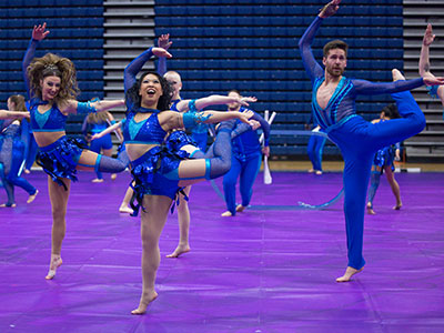 High school guards are great, but when the adult teams perform, the energy goes up.  High schoolers love them.