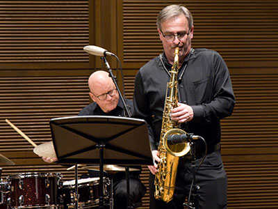 Garin Webb is still blowing jazz (see September 12, 2010) while Jim Leslie keeps the beat (July 22, 2022).