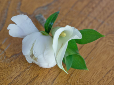 The boutonniere I wore two nights ago is hanging on.