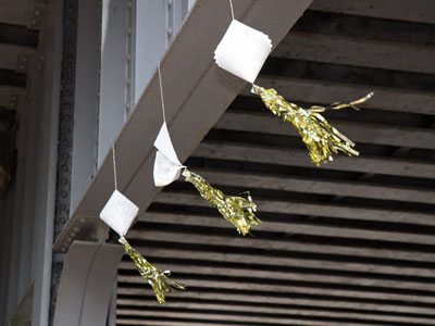 Festivities under a railroad bridge.