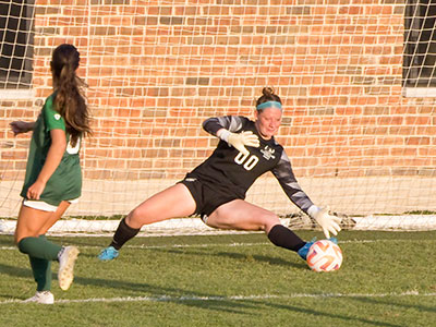 The visiting goalie looked straight into the sun for the first half.