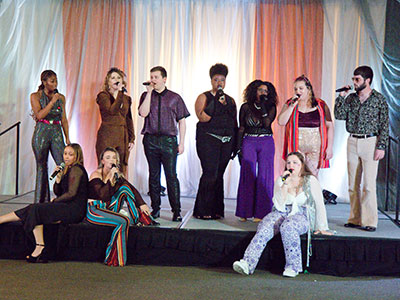 Young vocal students sang funk songs from the 1970s.