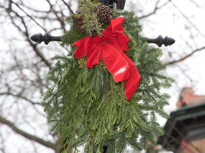 Unknown people repair the lamppost in front of my house, and also keep it decorated for Christmas.