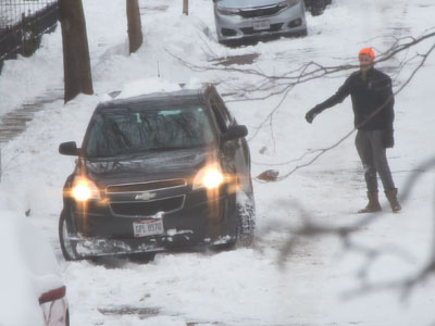 And on the third day . . . people are still getting stuck.  The guy helped a lot by gesturing to the driver.