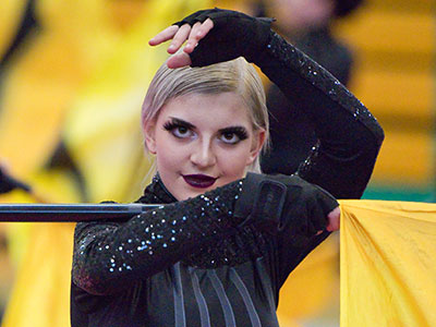 The four stripes on her uniform represent violin strings.