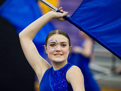 The gym was unusually small, so the performers flung their flags, rifles and sabers alarmingly close to my face.