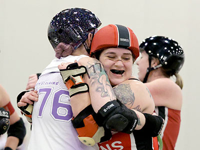 The skaters knock each other down, but it`s all for fun.