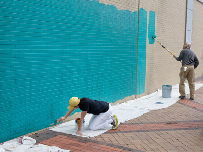 The mural artist said, `It`s going to be boring for a few days.  Come back later in the week.`