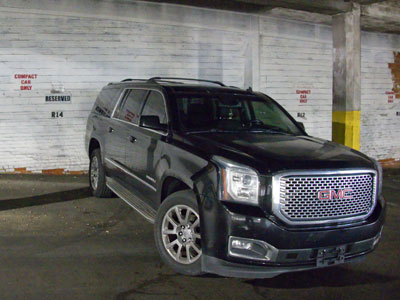 Behind this massive vehicle, the wall says COMPACT CAR ONLY.  I could barely drive past it this morning.