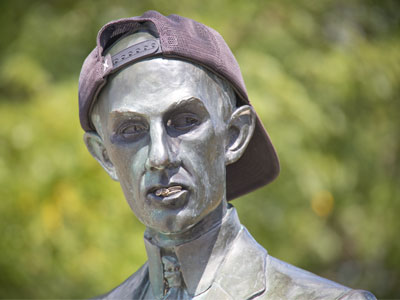 Wilbur Wright with a backwards cap and gold teeth.
