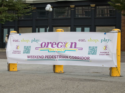 The barricades now have new banners with the euphemism Weekend Pedestrian Corridor.  I have other words for what happens in the Oregon District.