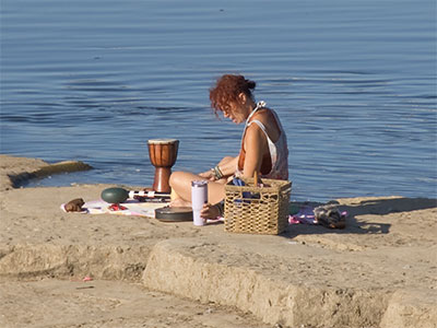 She had a variety of percussion instruments and seemed to be playing a concert for the gulls.