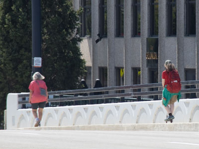 Street level kindness:  the girl on the scooter went very slowly to avoid startling the woman in front of her. Street level kindness:  the girl on the scooter went very slowly to avoid startling the woman in front of her.