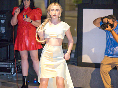 At 8:10pm, the finished outfit is seen in a fashion show. At 8:10pm, the finished outfit is seen in a fashion show.