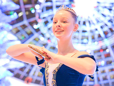 I take pictures with my camera on my lap, so it doesn`t distract the dancers, who are just a few feet away.