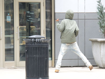 Dancing in front of his reflection in the shop window.