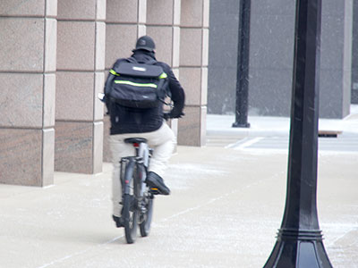 Unsafe at any speed.  He was looking at his smart watch as he rode past me.  Not very smart.